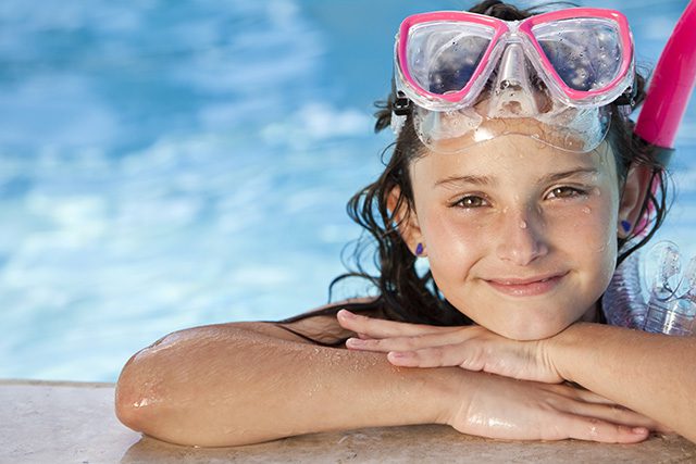 happy smiling relaxing goggle pool girl