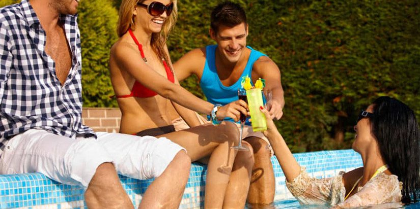 happy-young-friends-by-swimming-pool