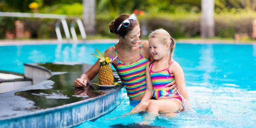 mother-little-girl-swimming-pool-pineapple